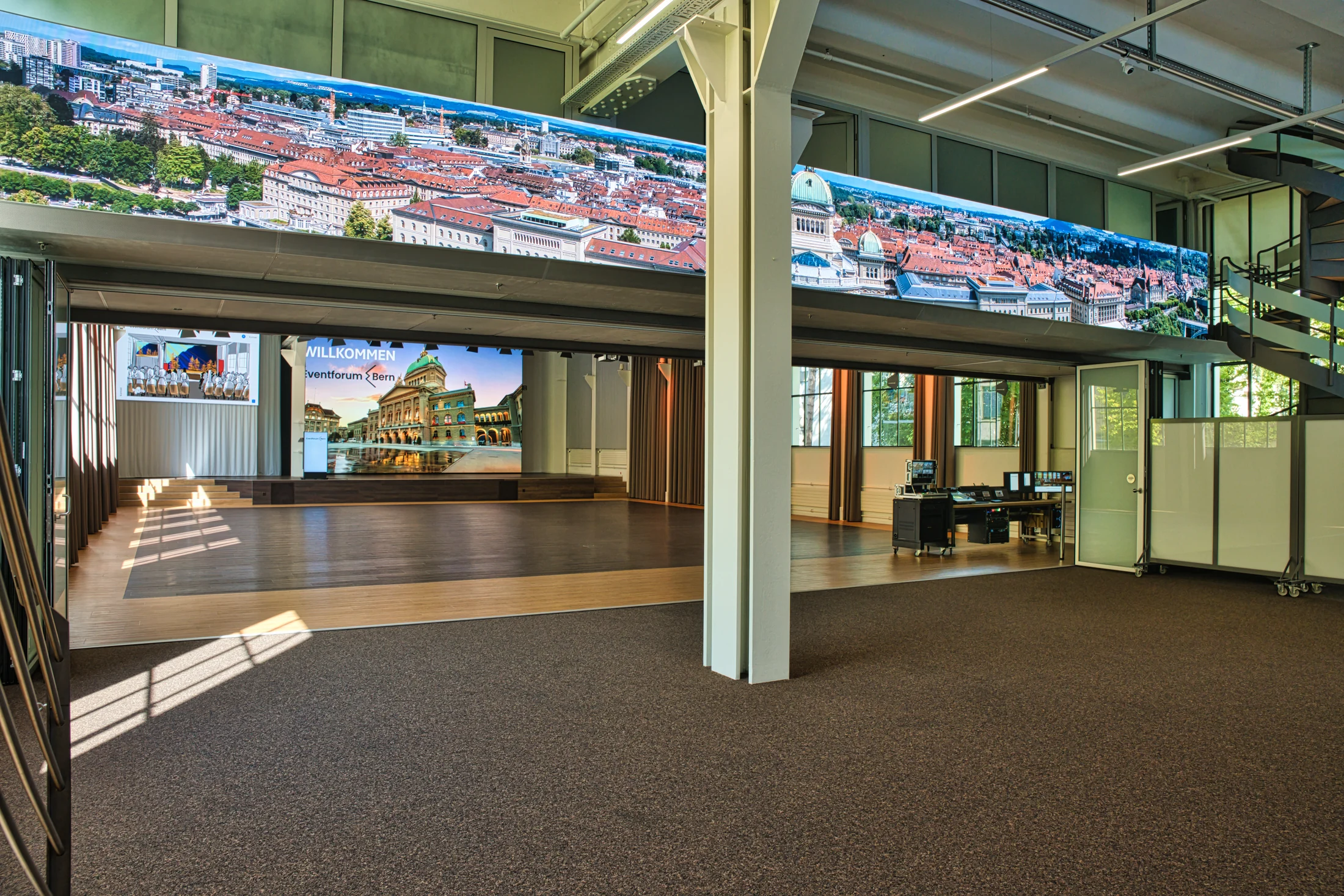 Continuous panoramic LED strip above the foyer and open glass partition.