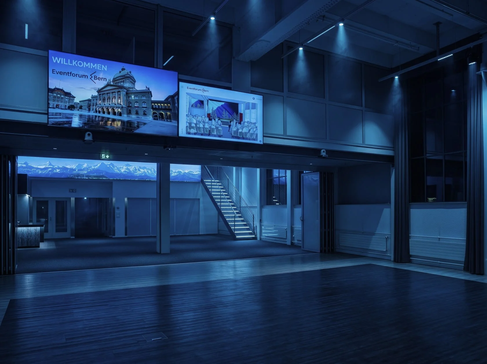 Empty event hall with monitors